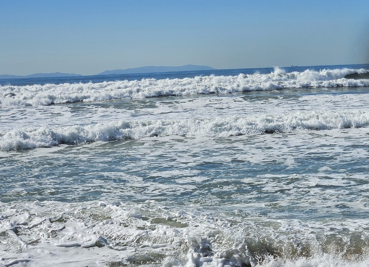 The violent beauty of the waves crashing ashore. 