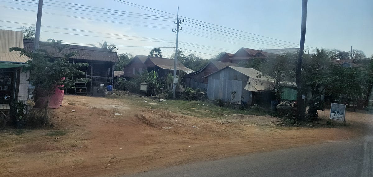 Poor shacks along the highway to Phnom Penh