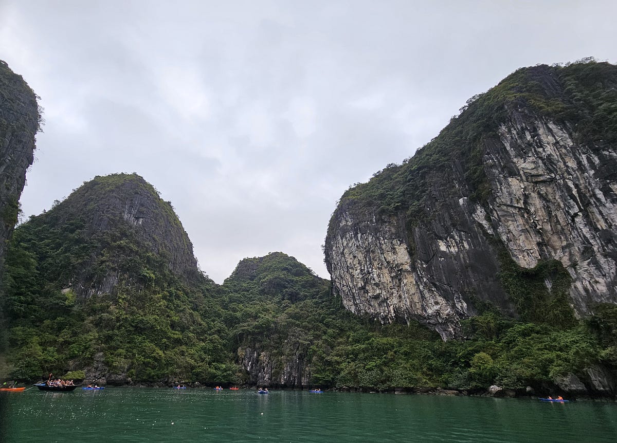 A lagoon carved into a large Karst, surrounded by sheer cliffs