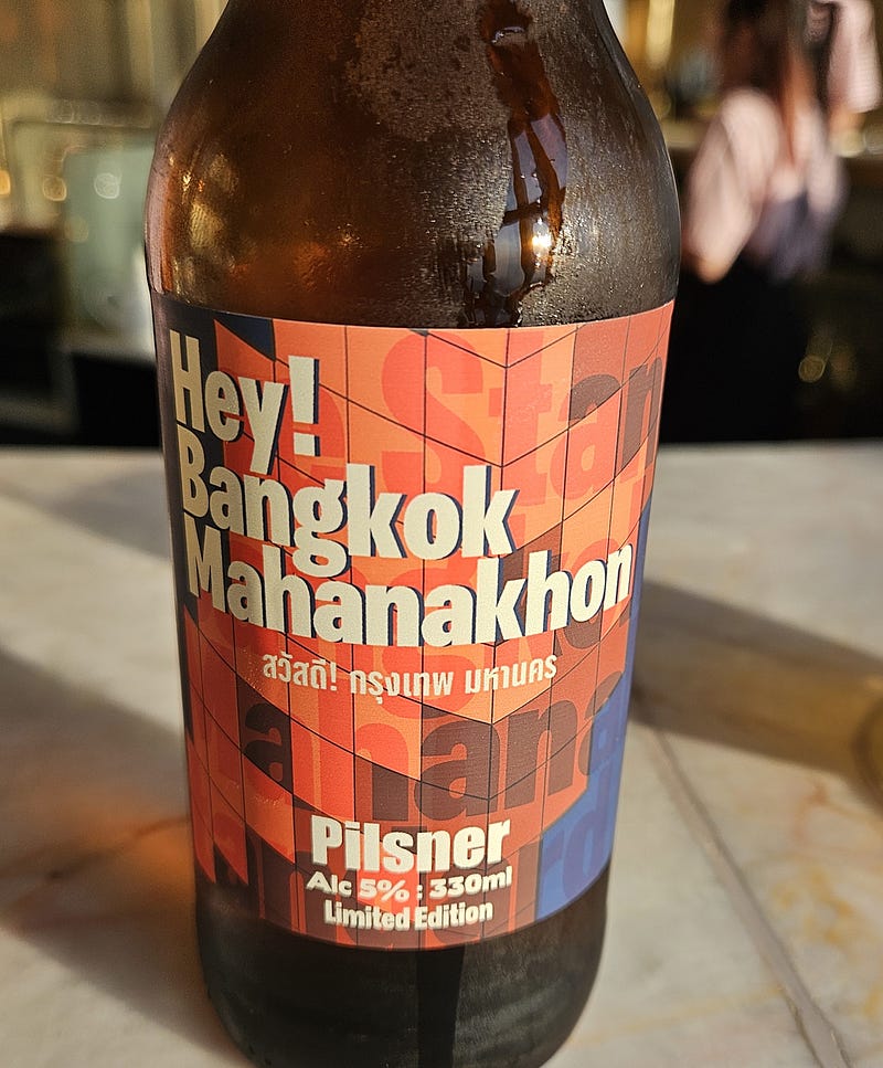 The label of a beer bottle. Bangkok Mahanakhan Tower beer.