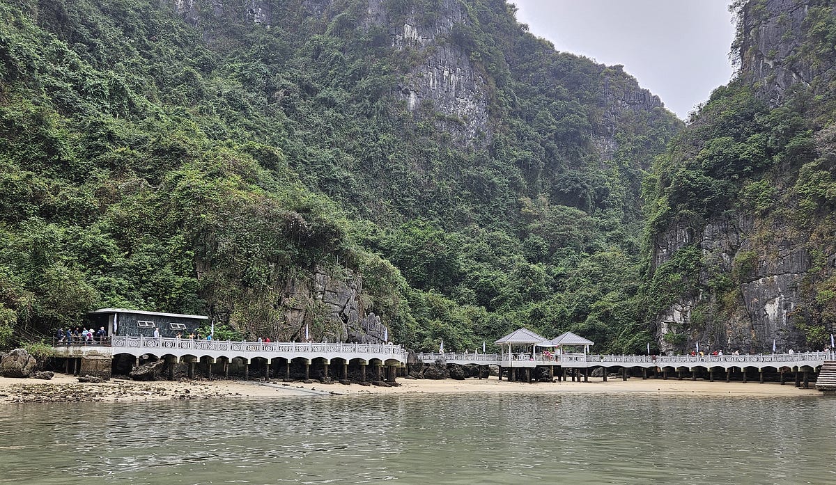 A walkway stretches along the base of a karst