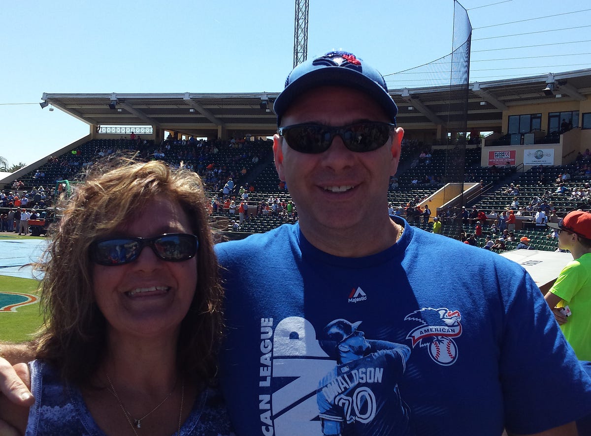 A man and woman at a spring training baseball game