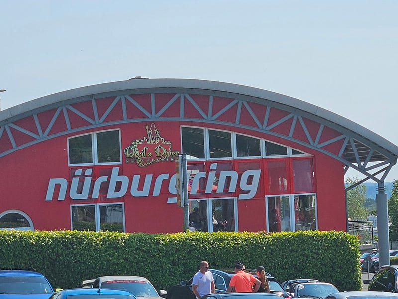 A red building with a round roof, the Devil’s Diner, at the Nurburgring.