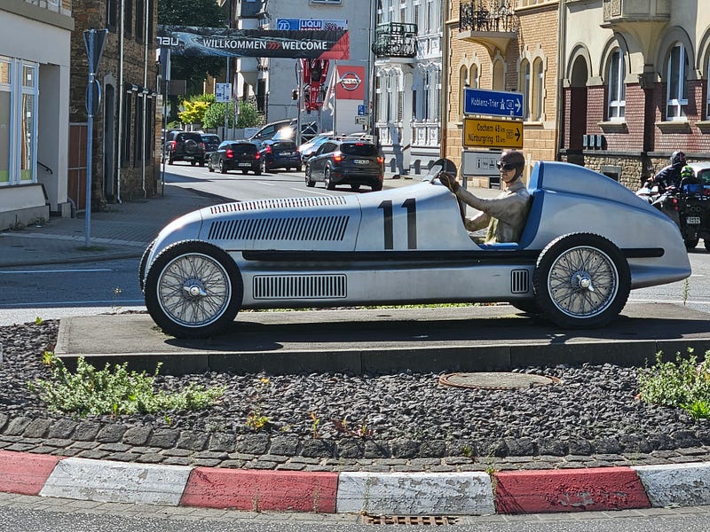 A statue of an early race car in Adenau, a town near the Nurburgring race track.