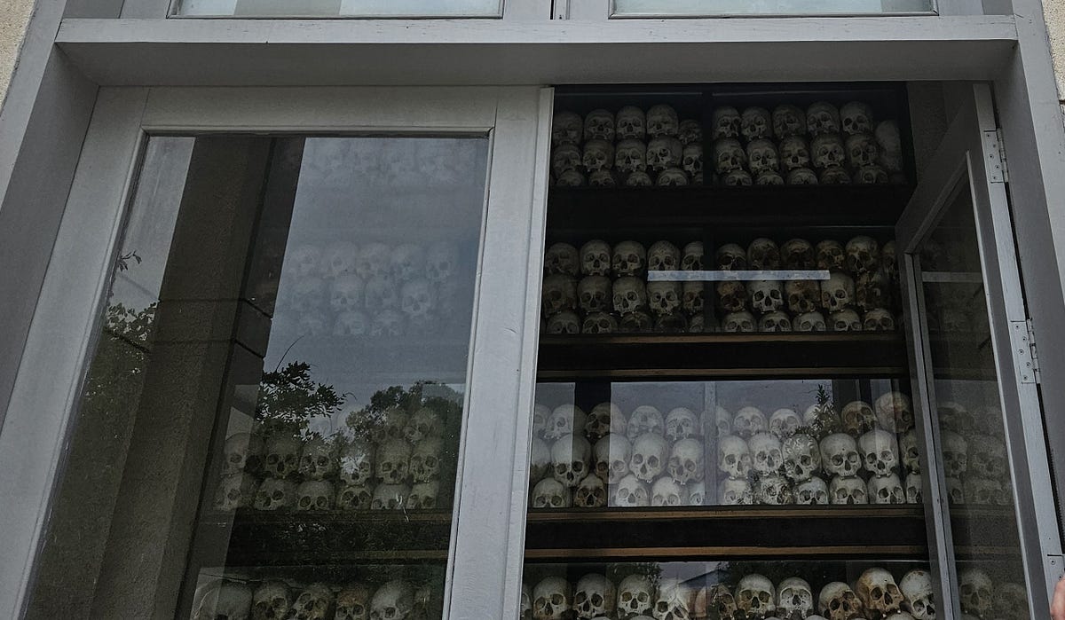 Thousands of skulls in glass cases, all with coloured dots on their head denoting how they were killed.